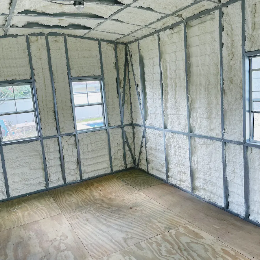 Closed-cell spray foam insulation applied to wall cavities in a residential project in Denham Springs